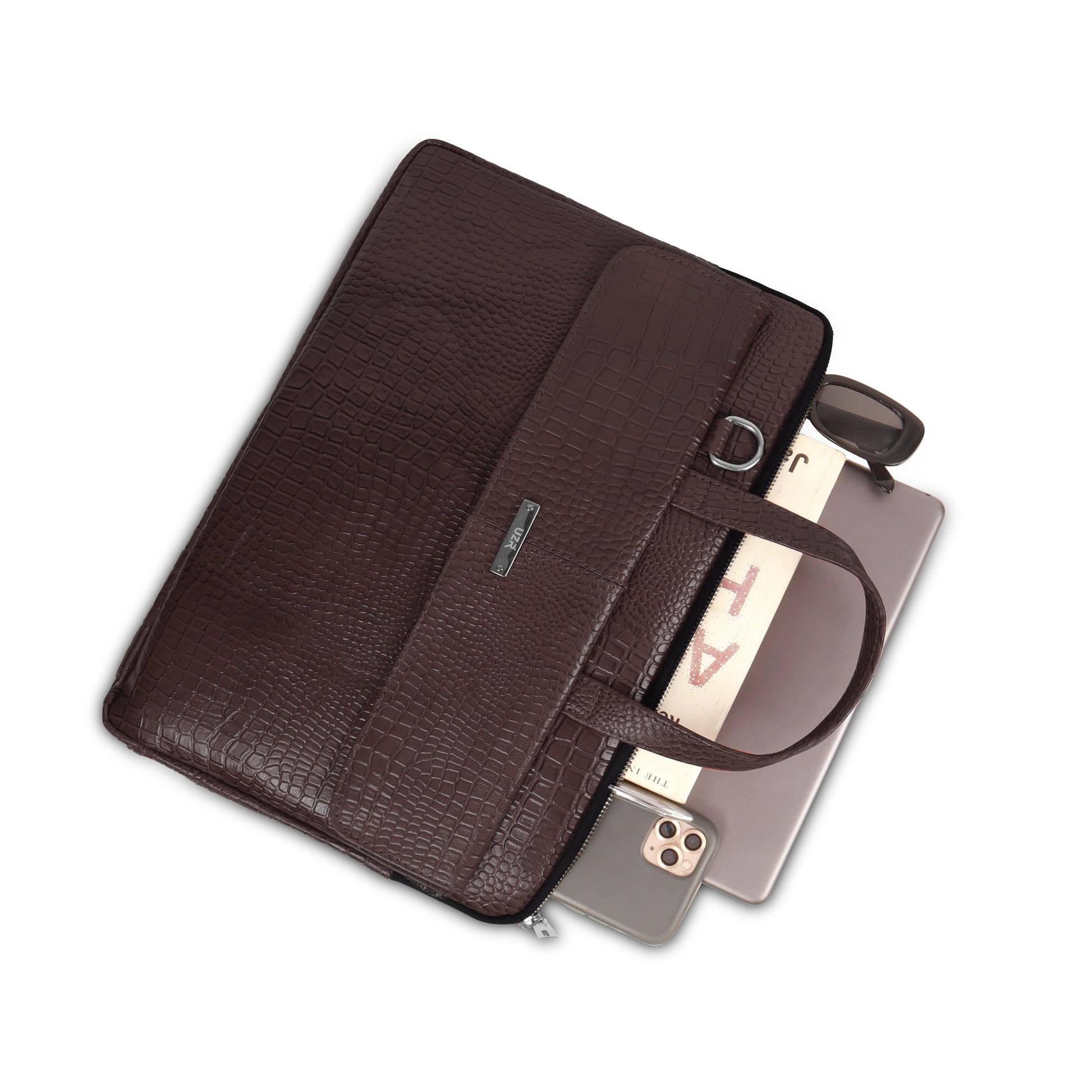 Brown leather briefcase with a phone inside on a white background