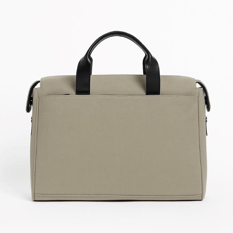 Beige handbag with black handles on a white background
