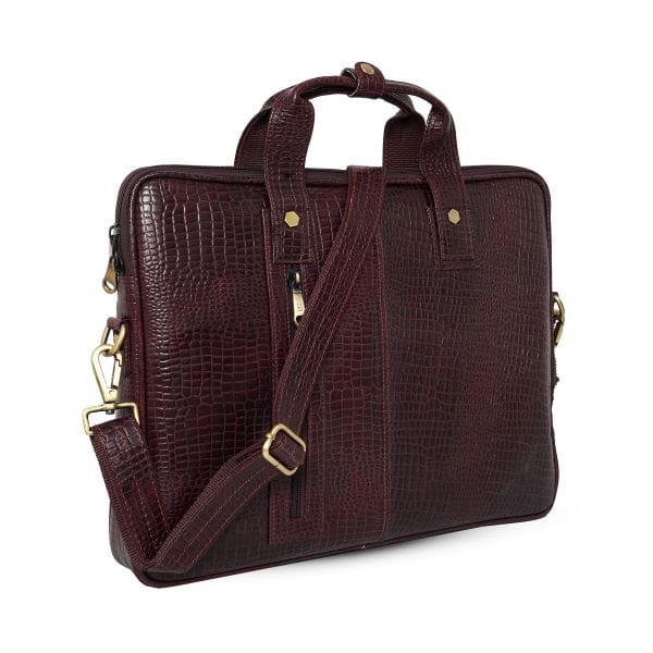 Angled view of UZR croc-textured burgundy leather messenger bag