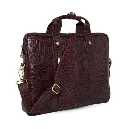 Angled view of UZR croc-textured burgundy leather messenger bag